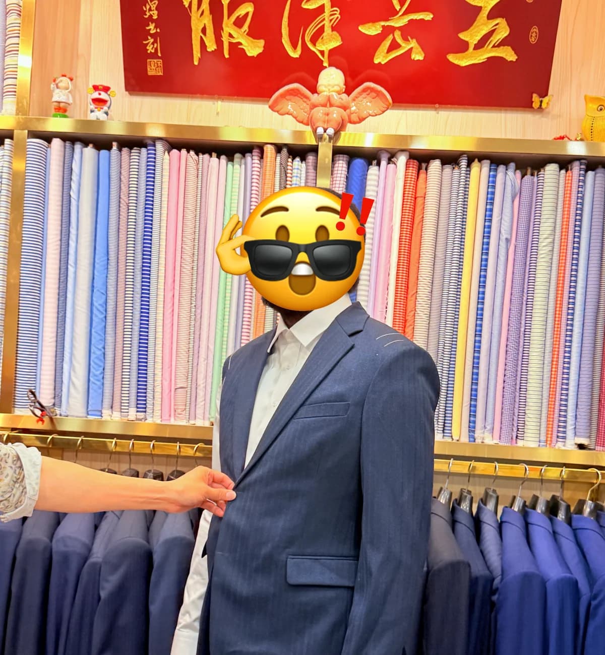 Client wearing a custom business suit during a fitting at Wuyue Bespoke Tailoring in Shanghai