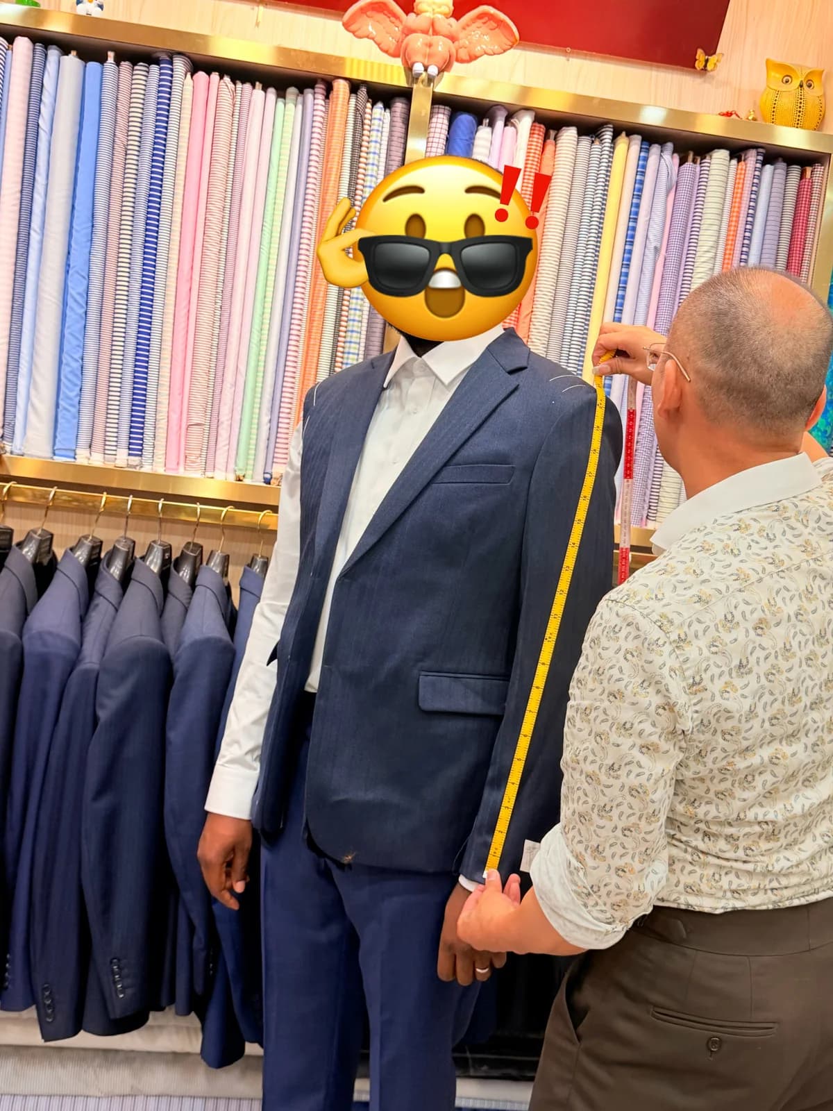 Shoulder measurement for a male custom suit client at Wuyue Shop 256 in Shanghai