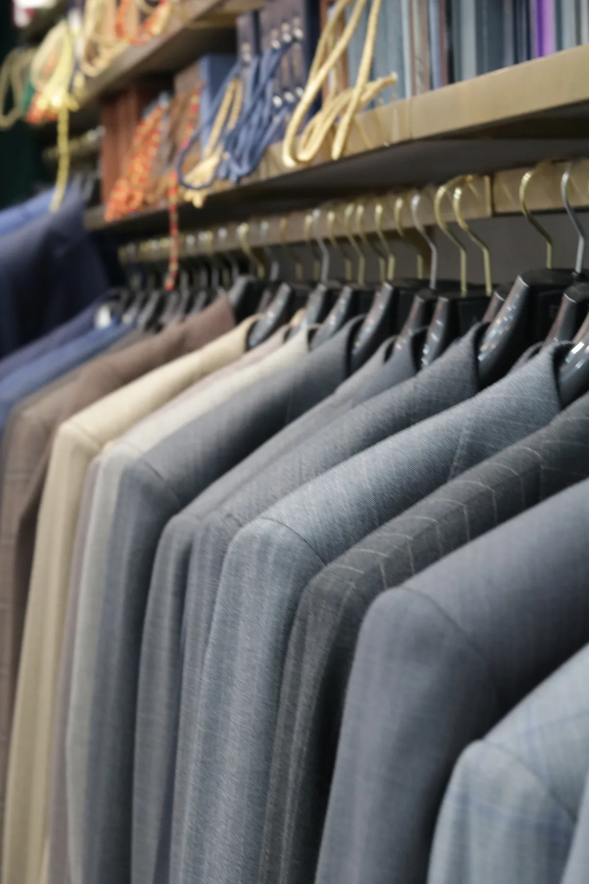Jackets lined up on a clothing rail inside the shop