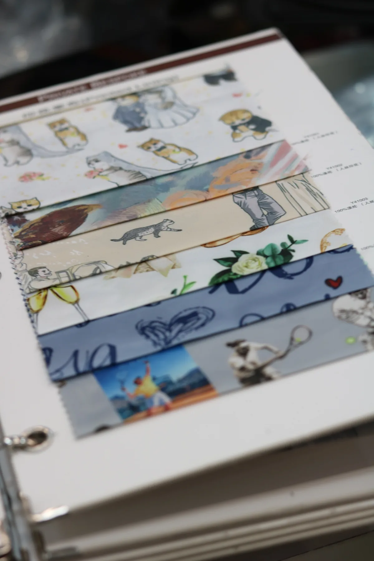 A vertical view of illustrated and patterned lining samples