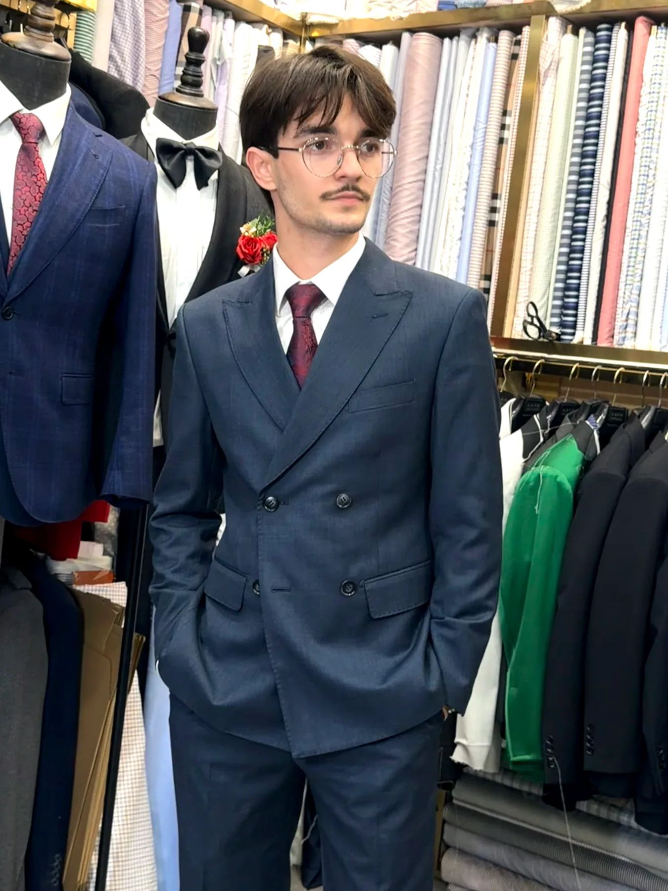 Three-quarter view of a navy double-breasted suit with peak lapels at Wuyue