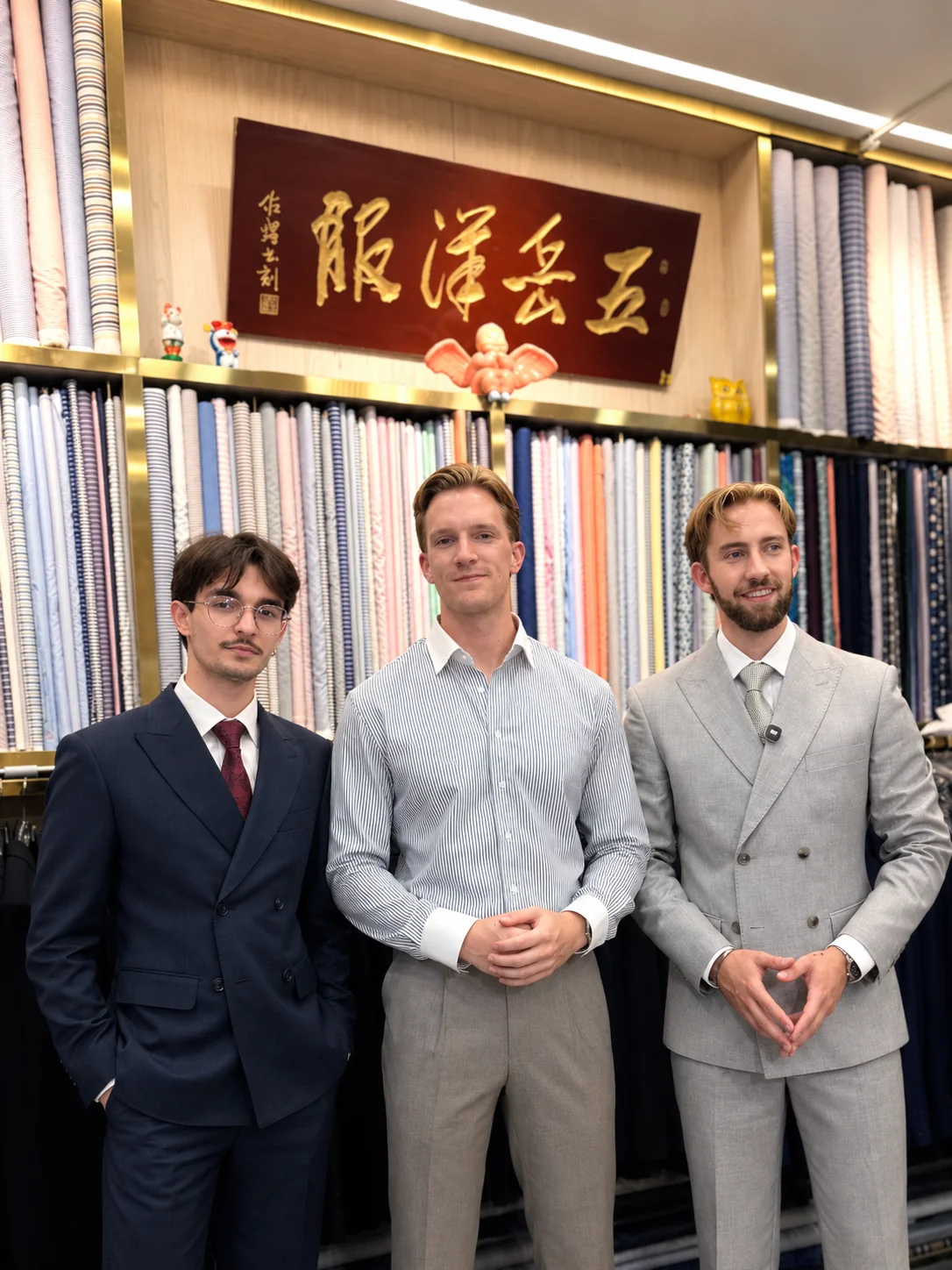 Three Dutch visitors together at Wuyue Shanghai, with navy and light-colored double-breasted suits