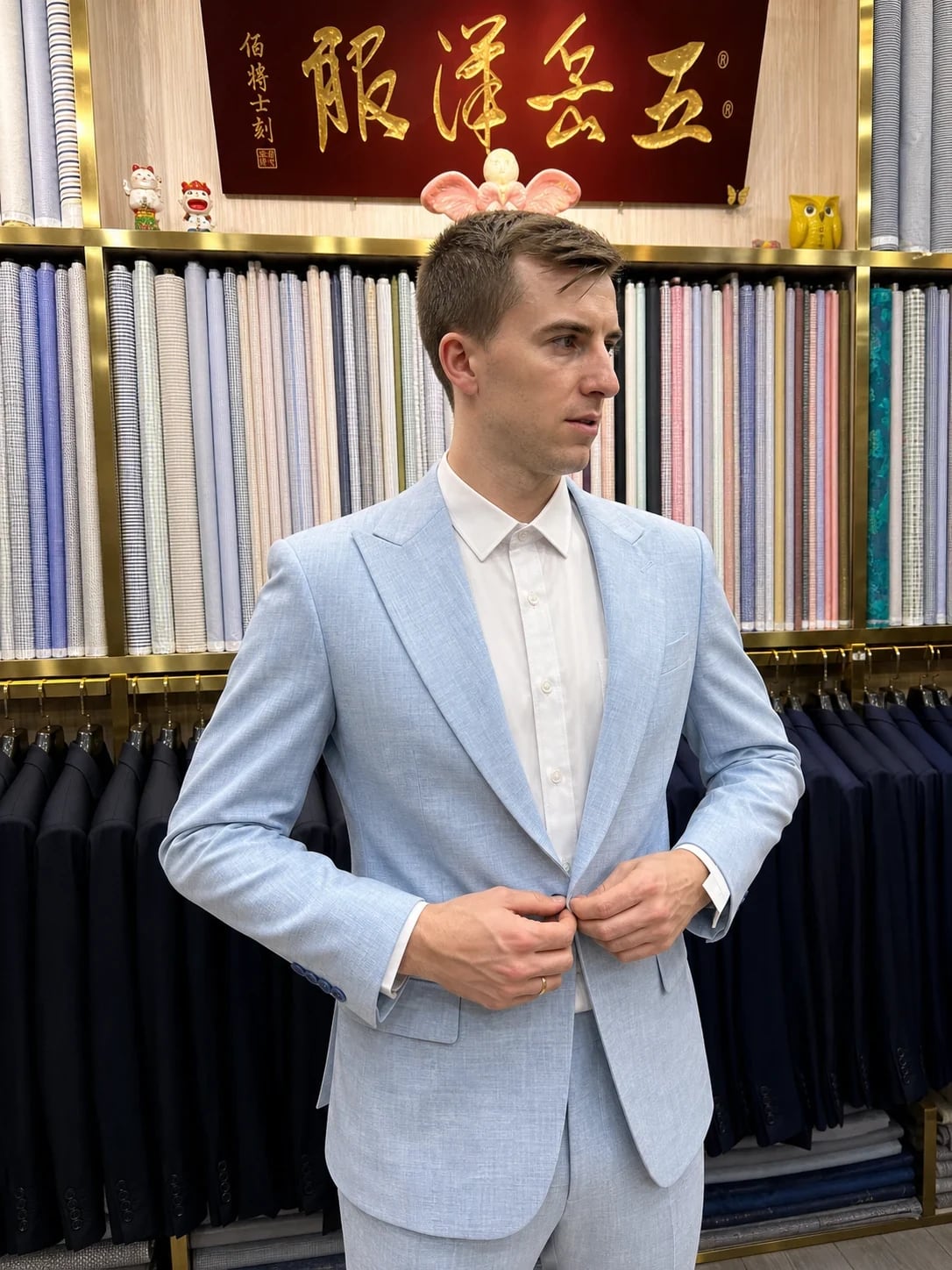 Three-quarter side view of a pale-blue two-piece suit at Wuyue Shanghai