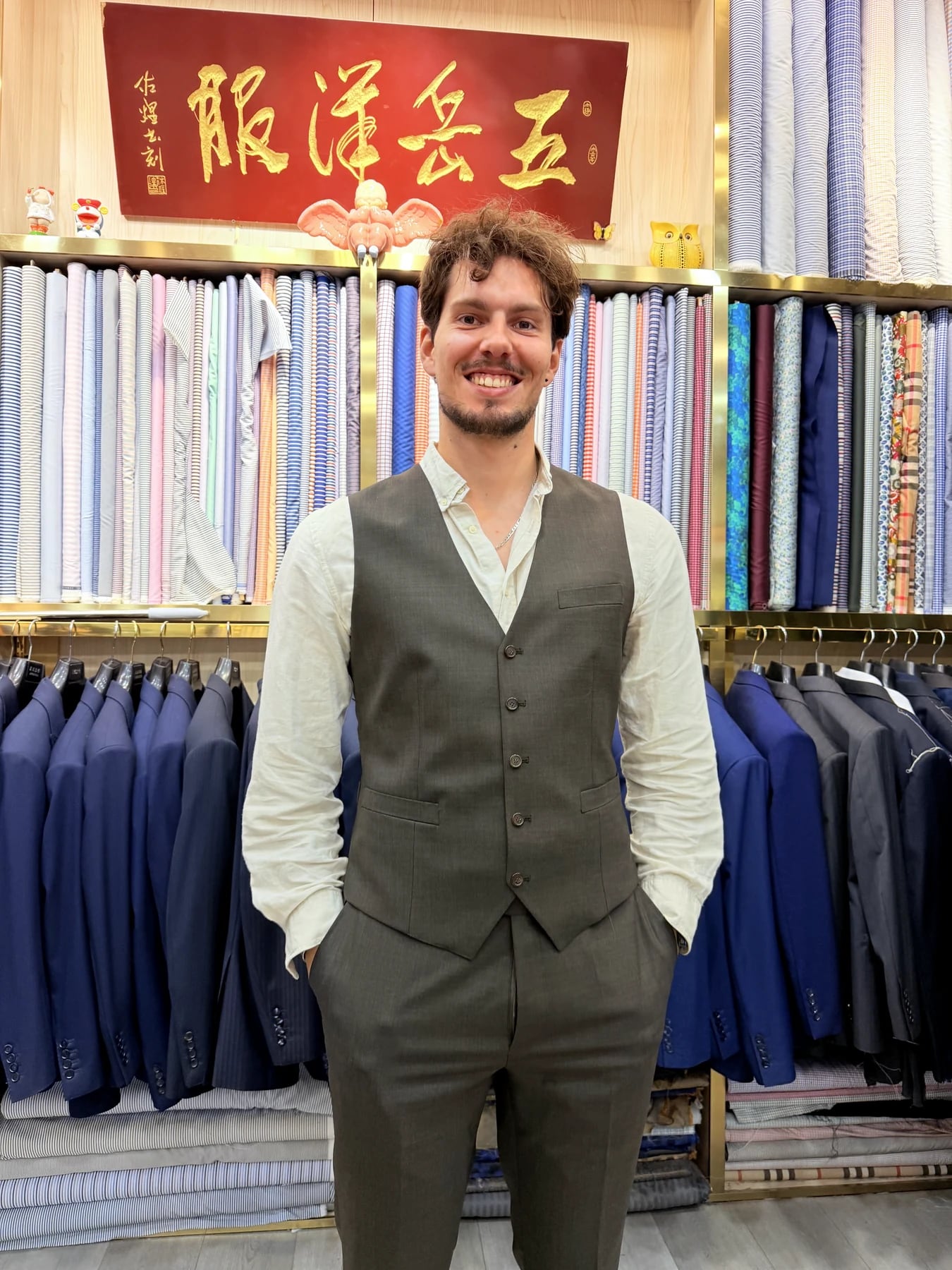 Client wearing the grey suit waistcoat and trousers without the jacket at Wuyue