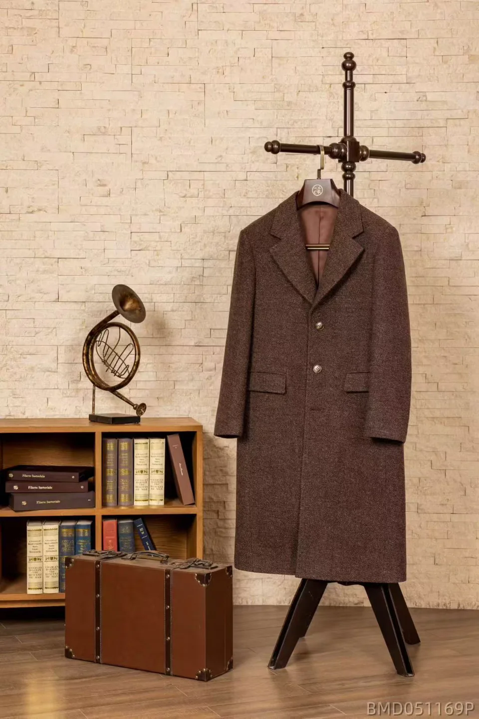 Brown herringbone overcoat styled with a travel suitcase