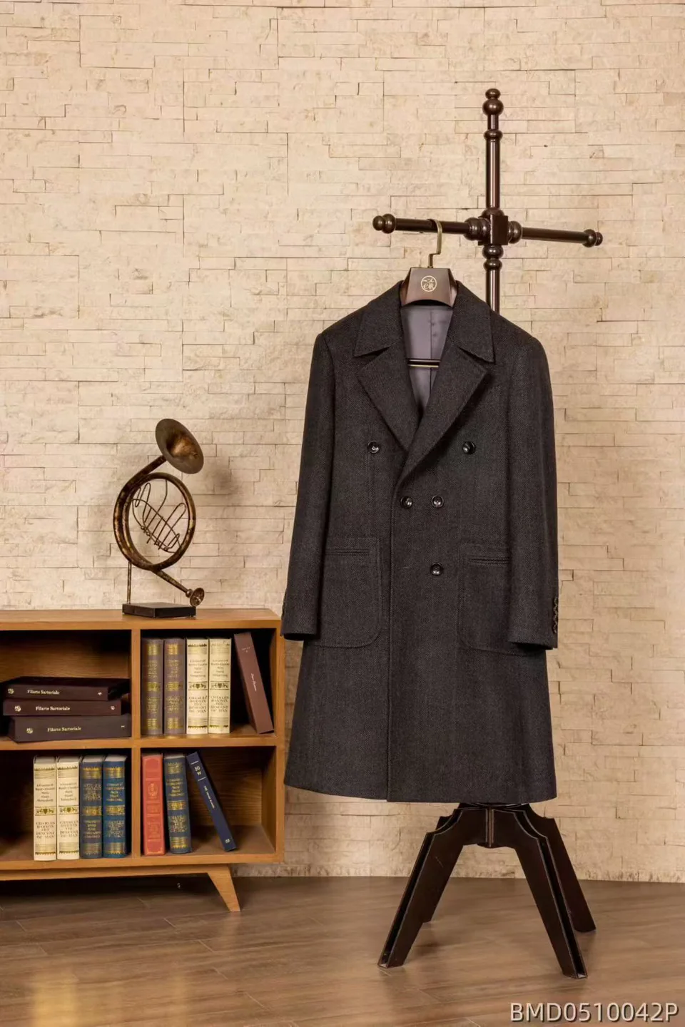 Charcoal double-breasted overcoat on a wooden hanger