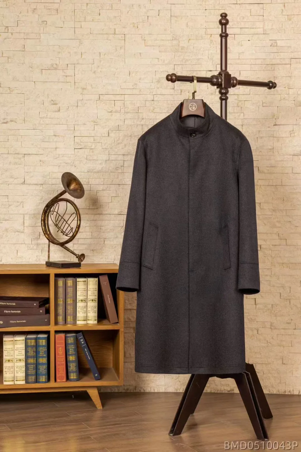 Charcoal stand-collar overcoat on a wooden hanger